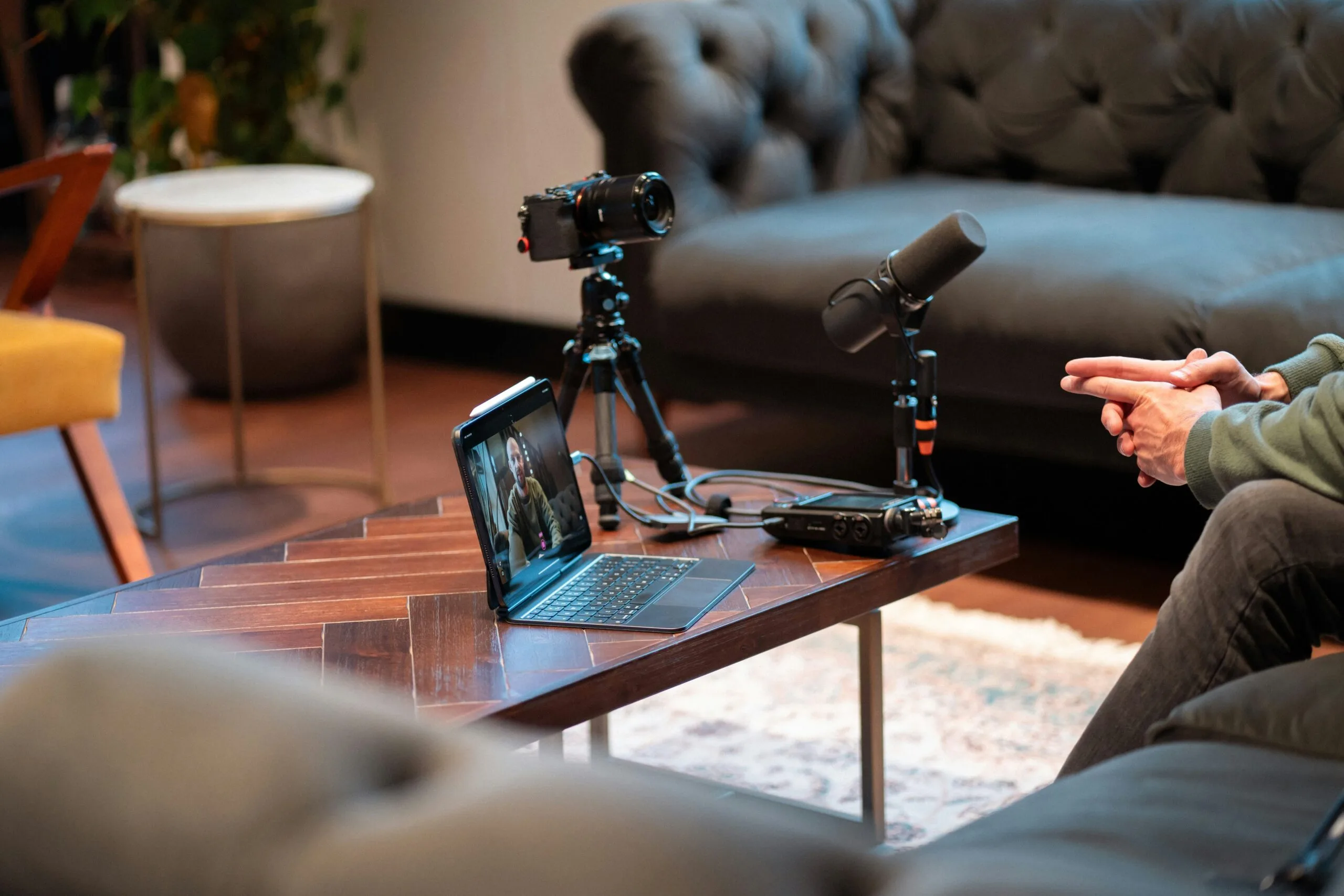 Behind-the-scenes professional video shoot setup recording an interview for a corporate commercial.